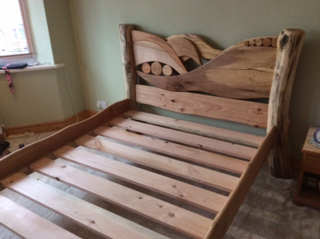 Artistic driftwood bed showcasing intricate craftsmanship.