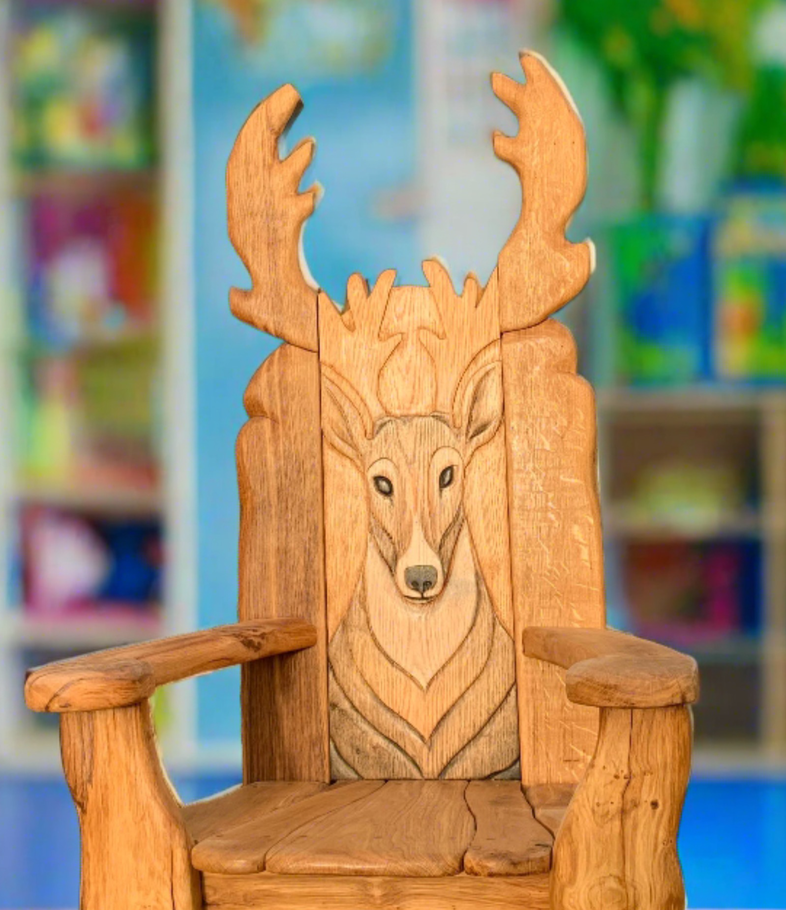 Wooden chair with deer carving in a colorful room.