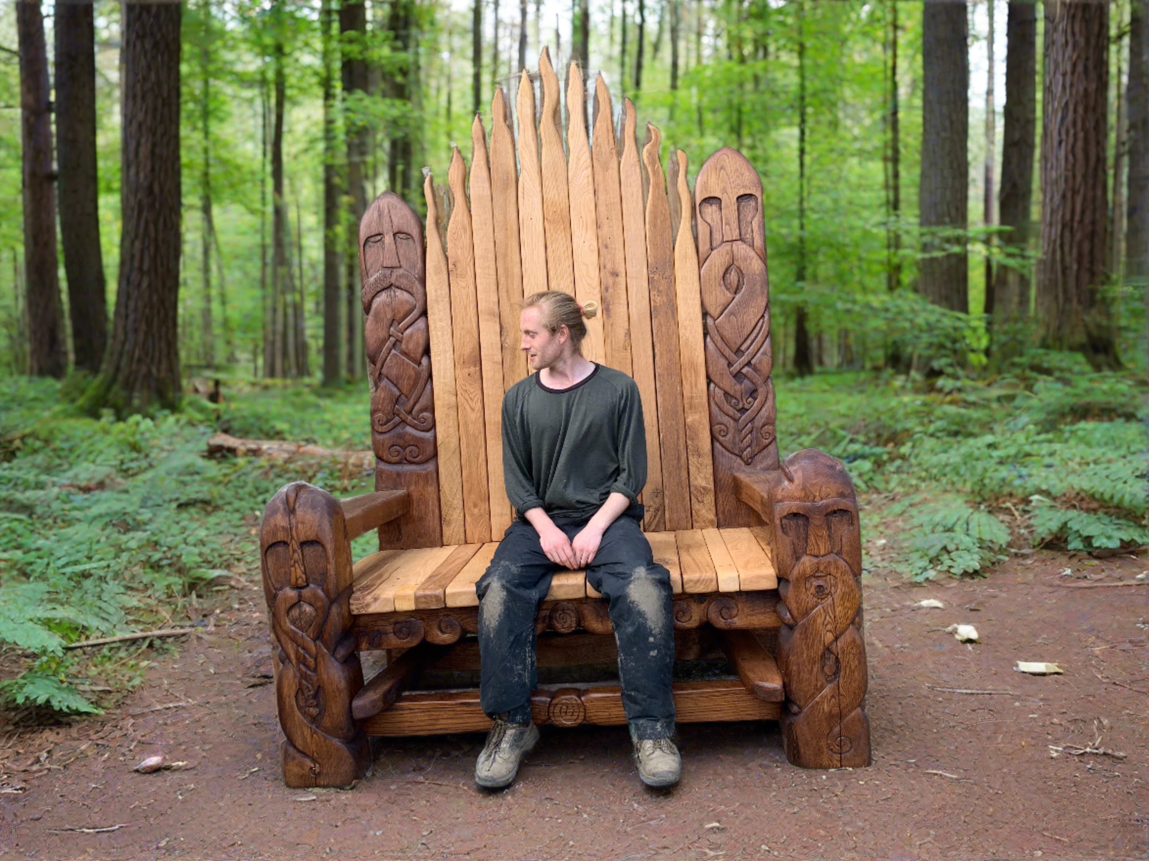 Viking-style wooden throne in forest setting