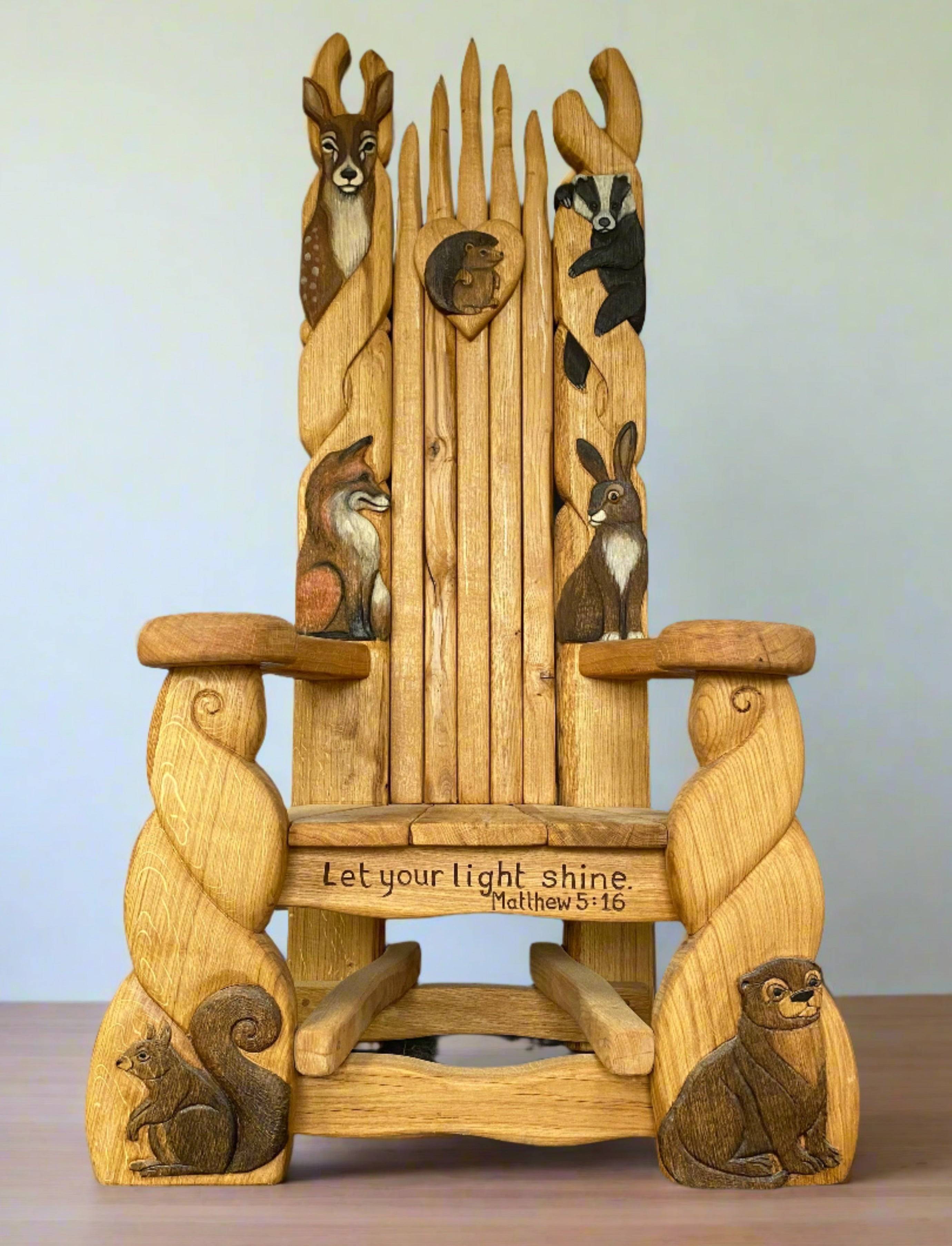 Wooden storytelling chair with animal carvings