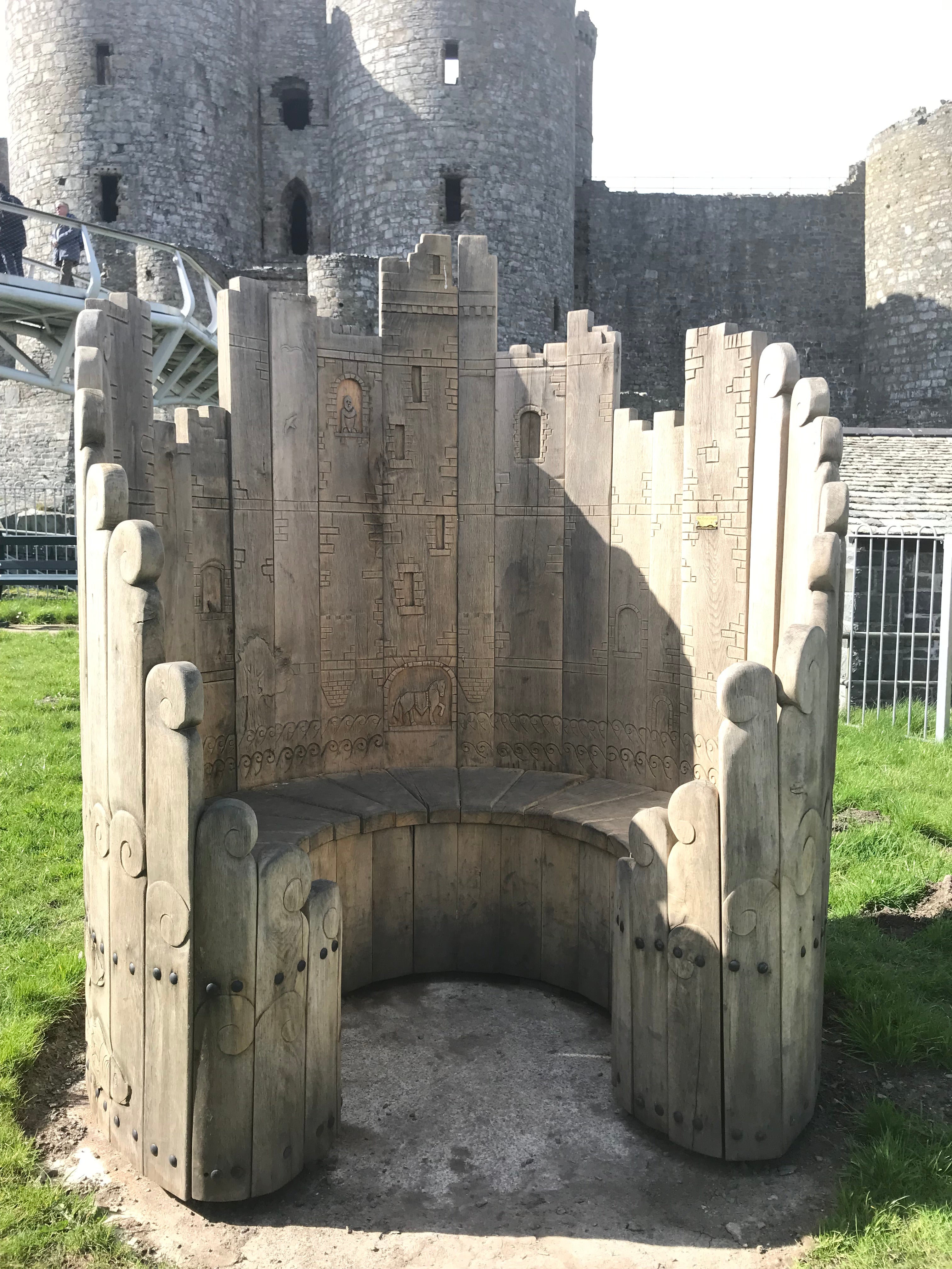 Circular wooden bench with castle design