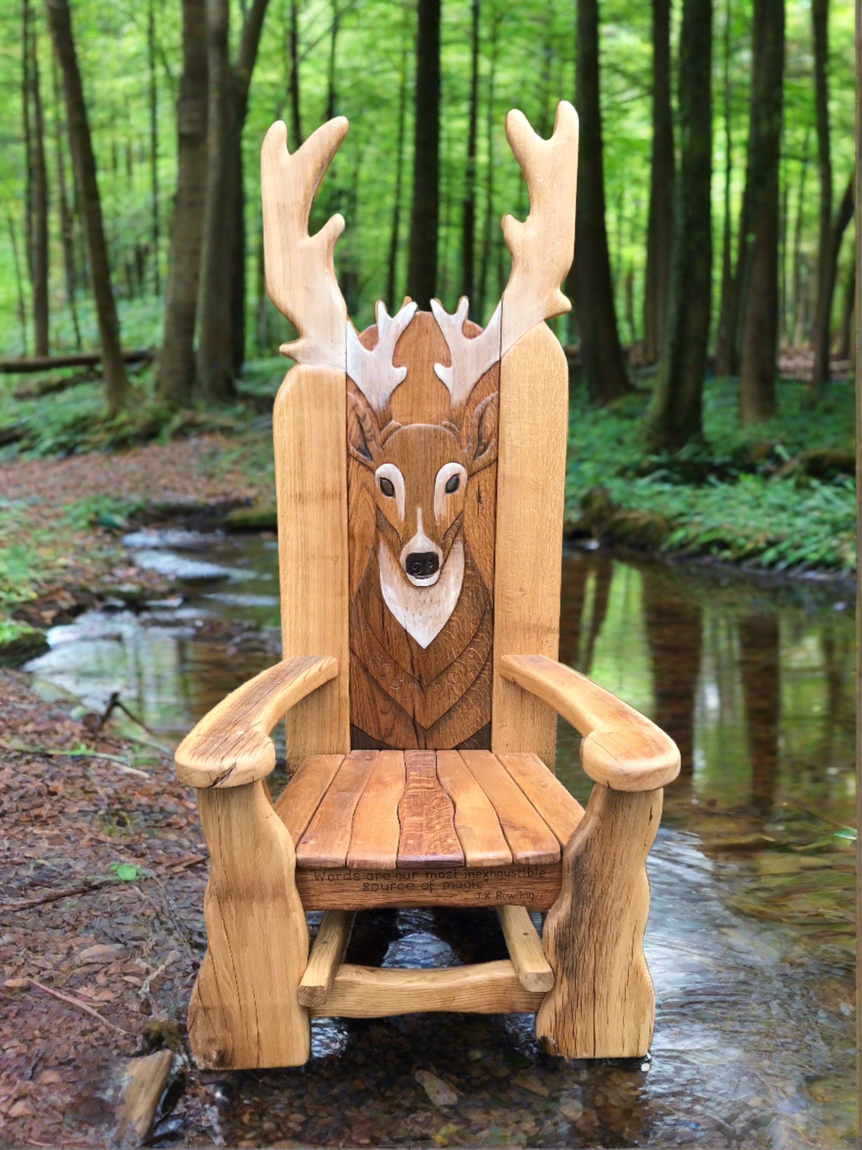 Wooden chair with deer carving in a forest.