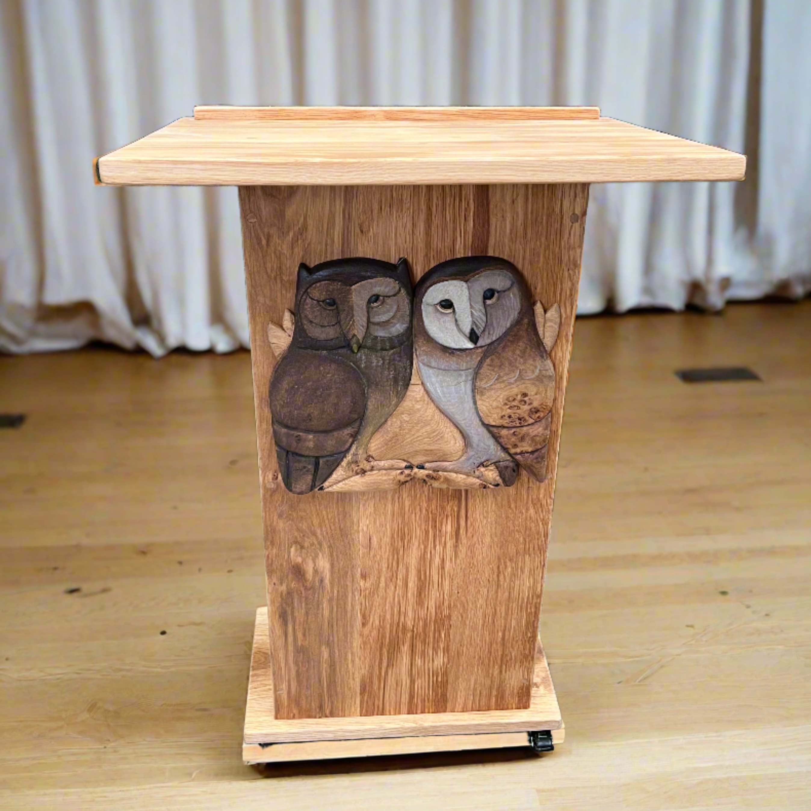 Custom wooden lectern featuring owl carvings