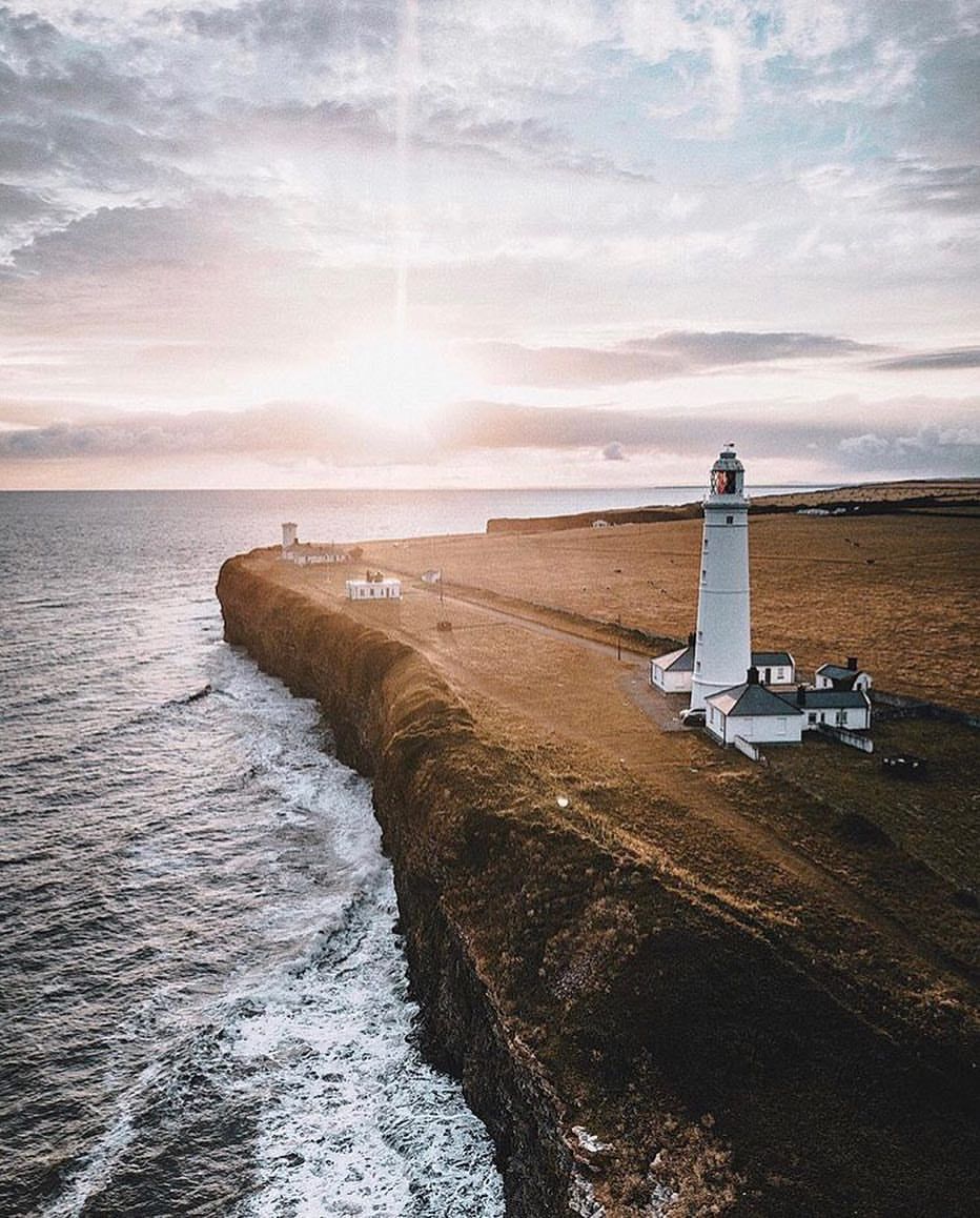 Coastal lighthouse at sunset