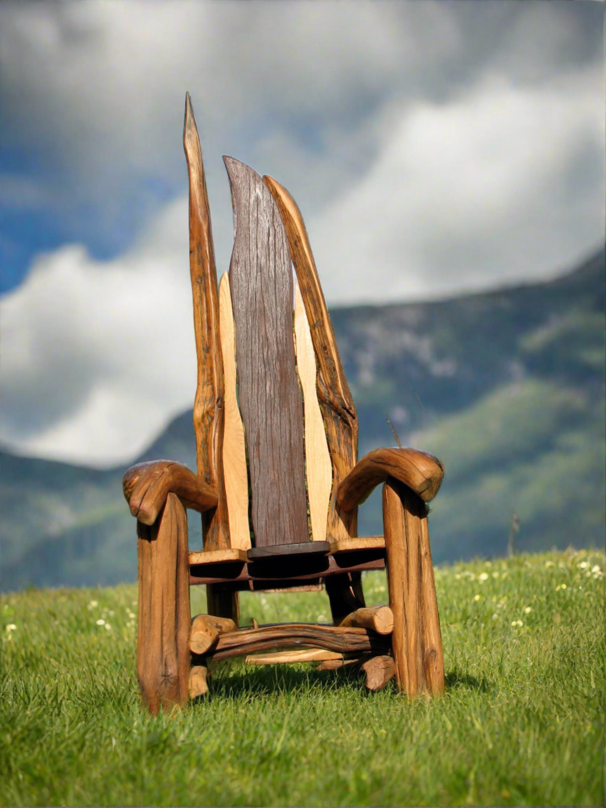 Three wooden chairs with branch designs