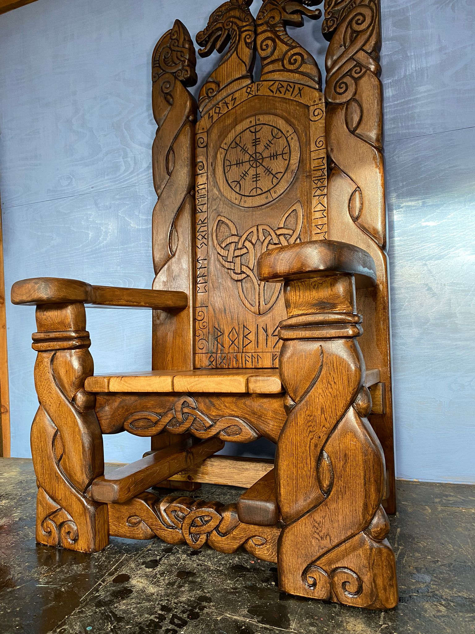 Side view of Viking Throne Chair with carvings