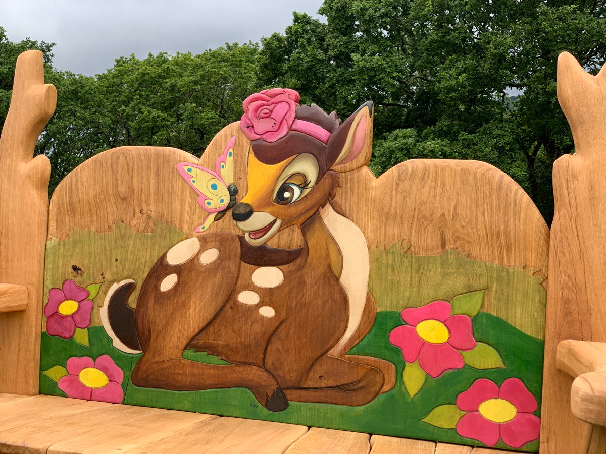 Handcrafted oak bench featuring Bambi and flowers