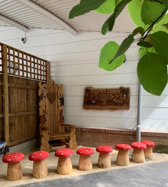 red mushroom wooden stool